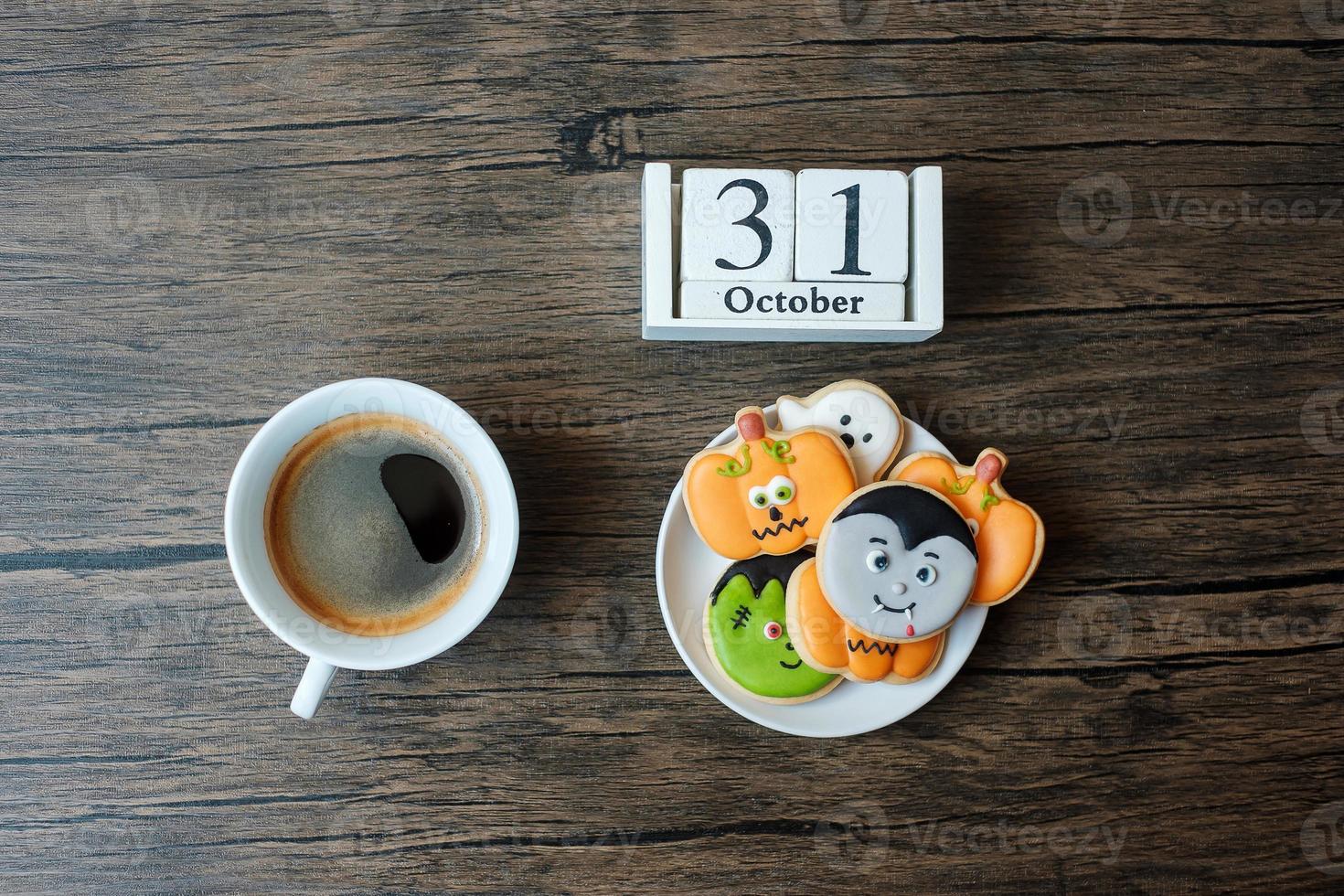 Happy Halloween day with cookies, coffee and 31 October calendar on white background. Trick or Threat, Hello October, fall autumn, Festive, party and holiday concept photo