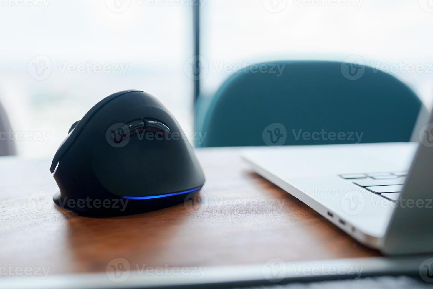 ergonomic mouse on desk at workplace, prevention wrist pain because working long time. De Quervain s tenosynovitis, Intersection Symptom, Carpal Tunnel Syndrome or Office syndrome concept photo