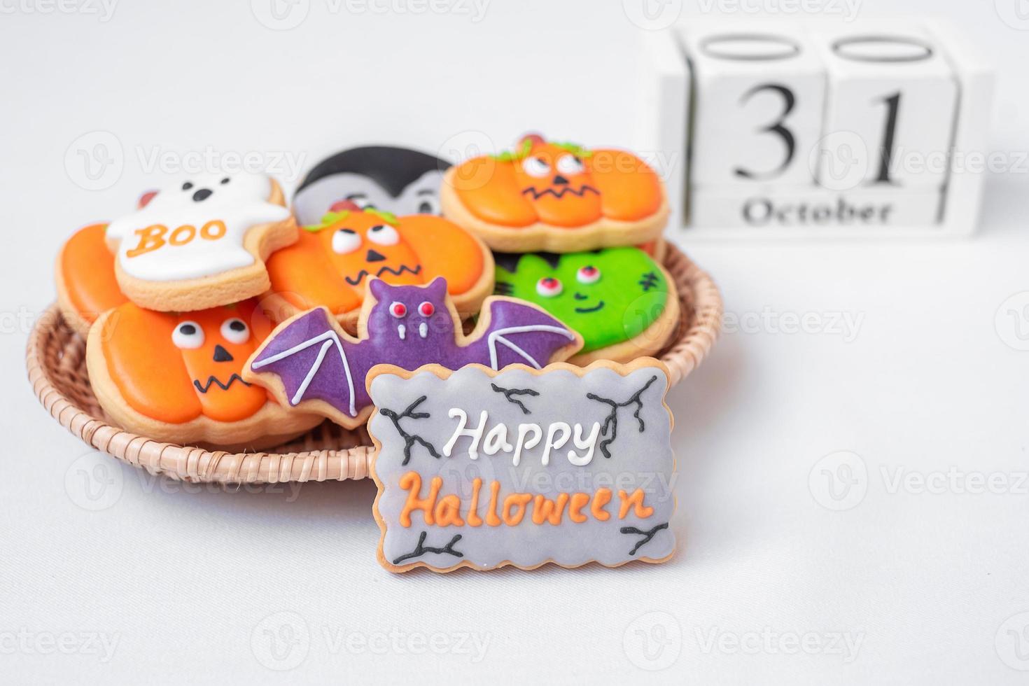 Halloween funny Cookies with 31 October calendar on white background. Trick or Threat, Happy Halloween, Hello October, fall autumn, Festive, party and holiday concept photo