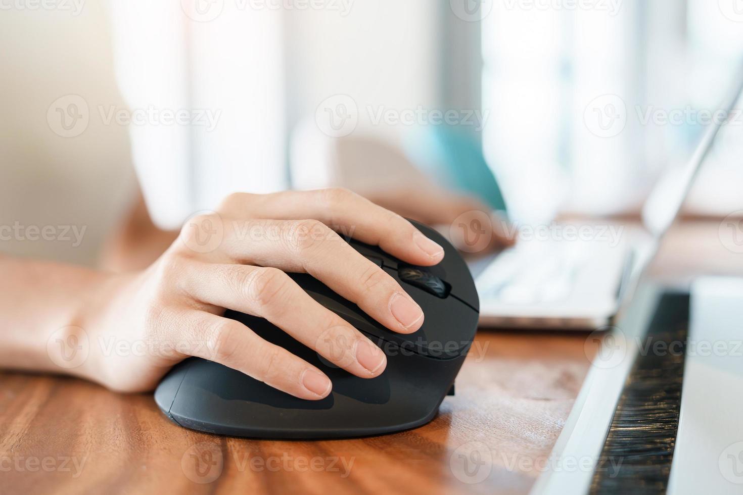 woman hand using computer ergonomic mouse, prevention wrist pain because working long time. De Quervain s tenosynovitis, Intersection Symptom, Carpal Tunnel Syndrome or Office syndrome concept photo
