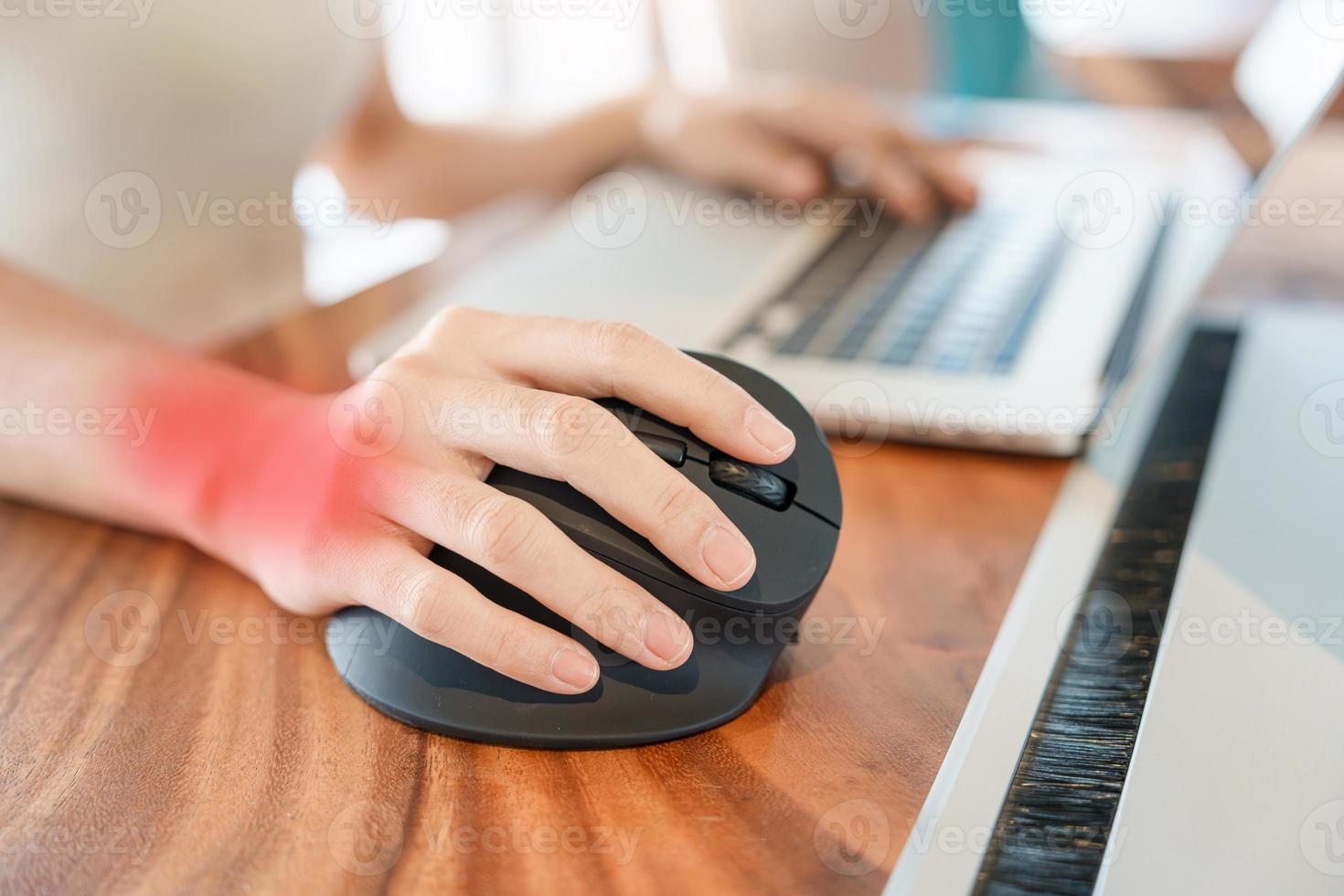 woman hand using computer ergonomic mouse, prevention wrist pain because working long time. De Quervain s tenosynovitis, Intersection Symptom, Carpal Tunnel Syndrome or Office syndrome concept photo