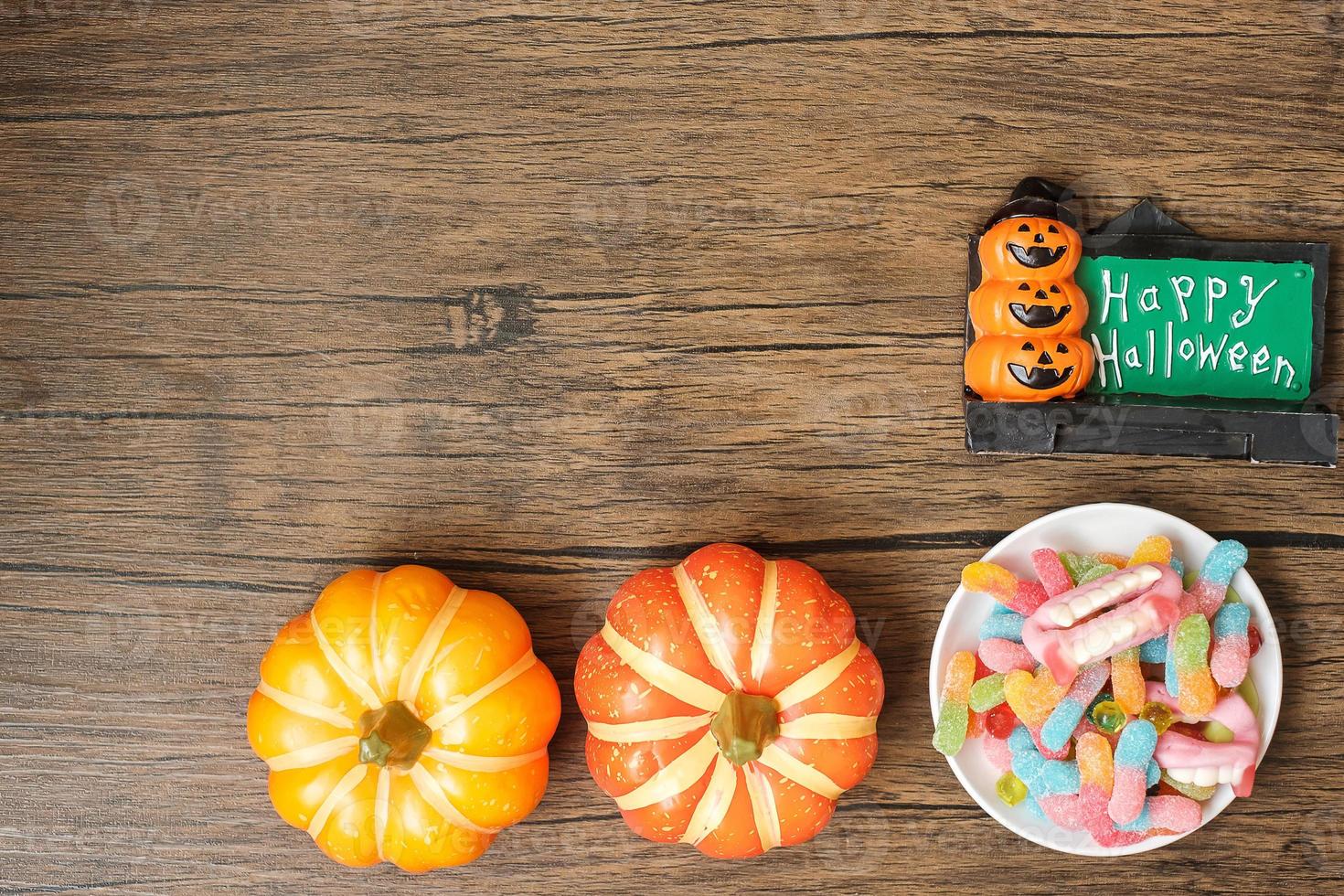 Happy Halloween day with ghost candies, pumpkin,  bowl and decorative. Trick or Threat, Hello October, fall autumn, Festive, party and holiday concept photo