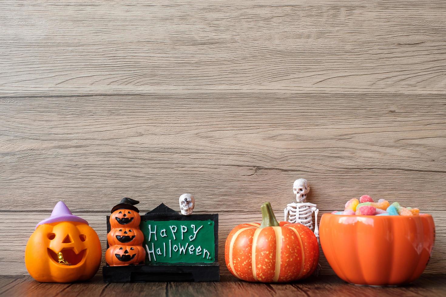 Happy Halloween day with ghost candies, pumpkin,  bowl and decorative. Trick or Threat, Hello October, fall autumn, Festive, party and holiday concept photo