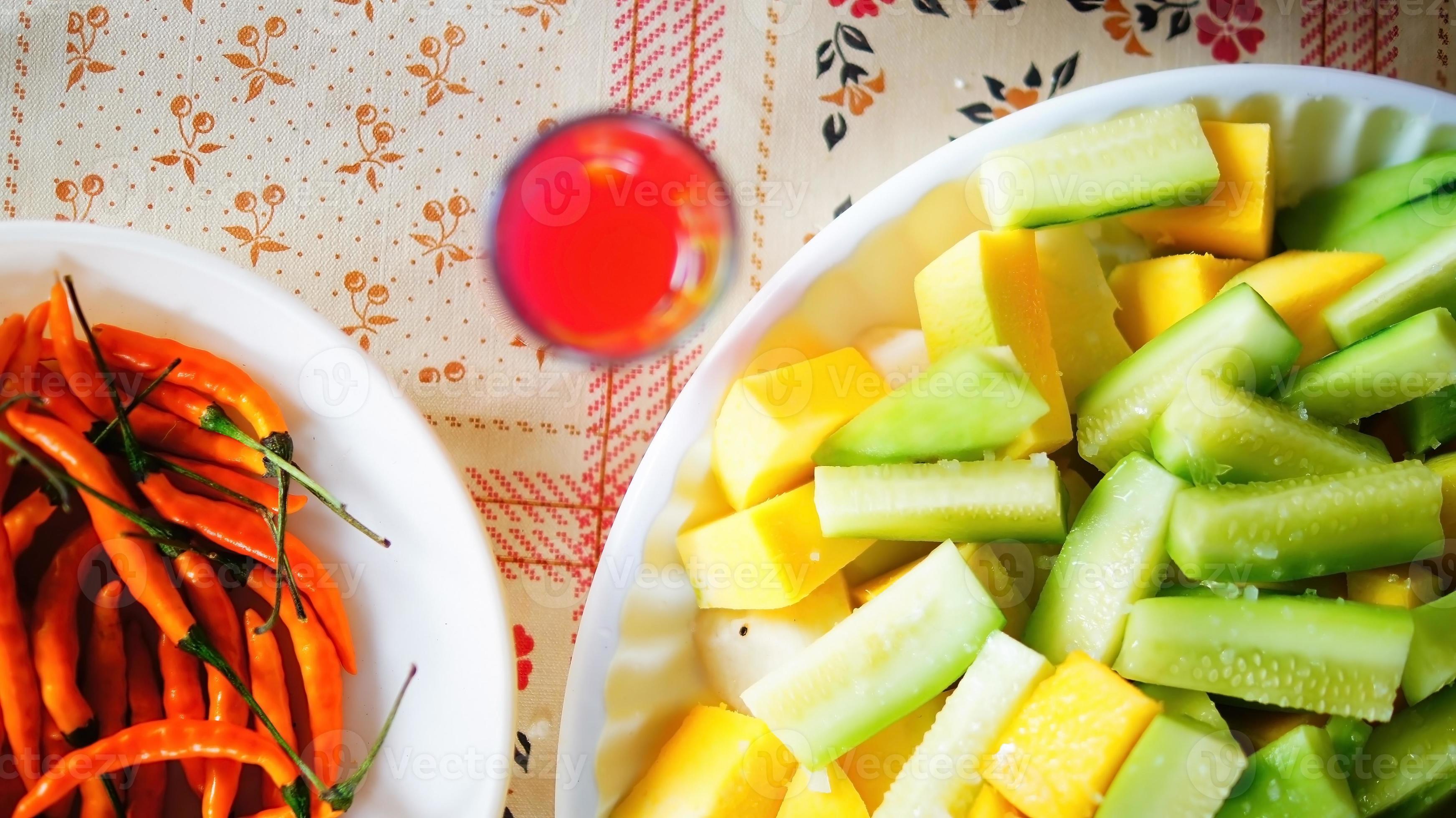 family reunion, sharing food or snack, fruit, cucumber, mango, prepared