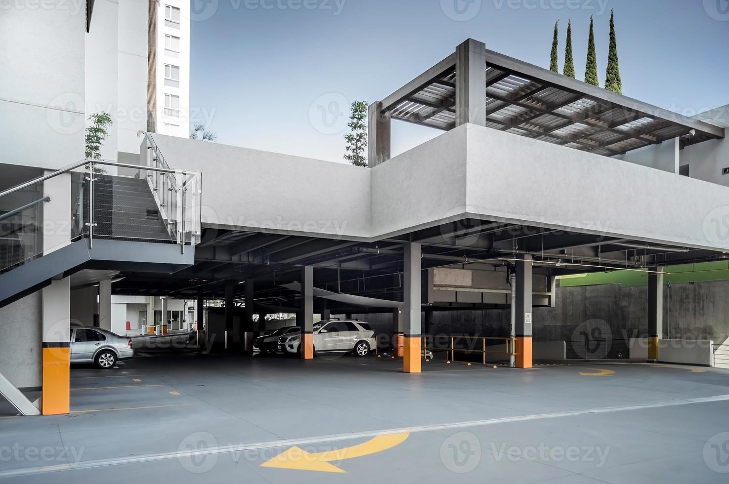 Large modern underground parking for cars. New underground car parking, garage photo