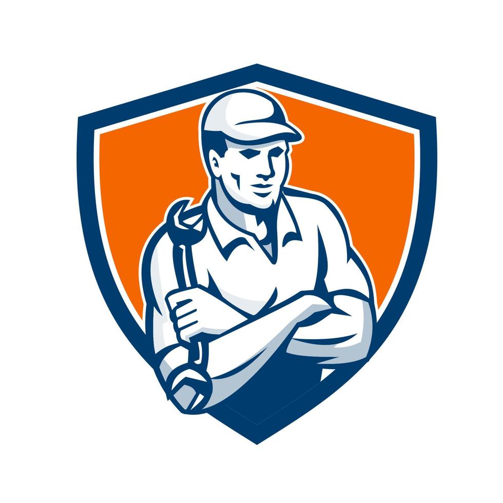 Mechanic Holding Spanner Arms Crossed Shield Retro vector