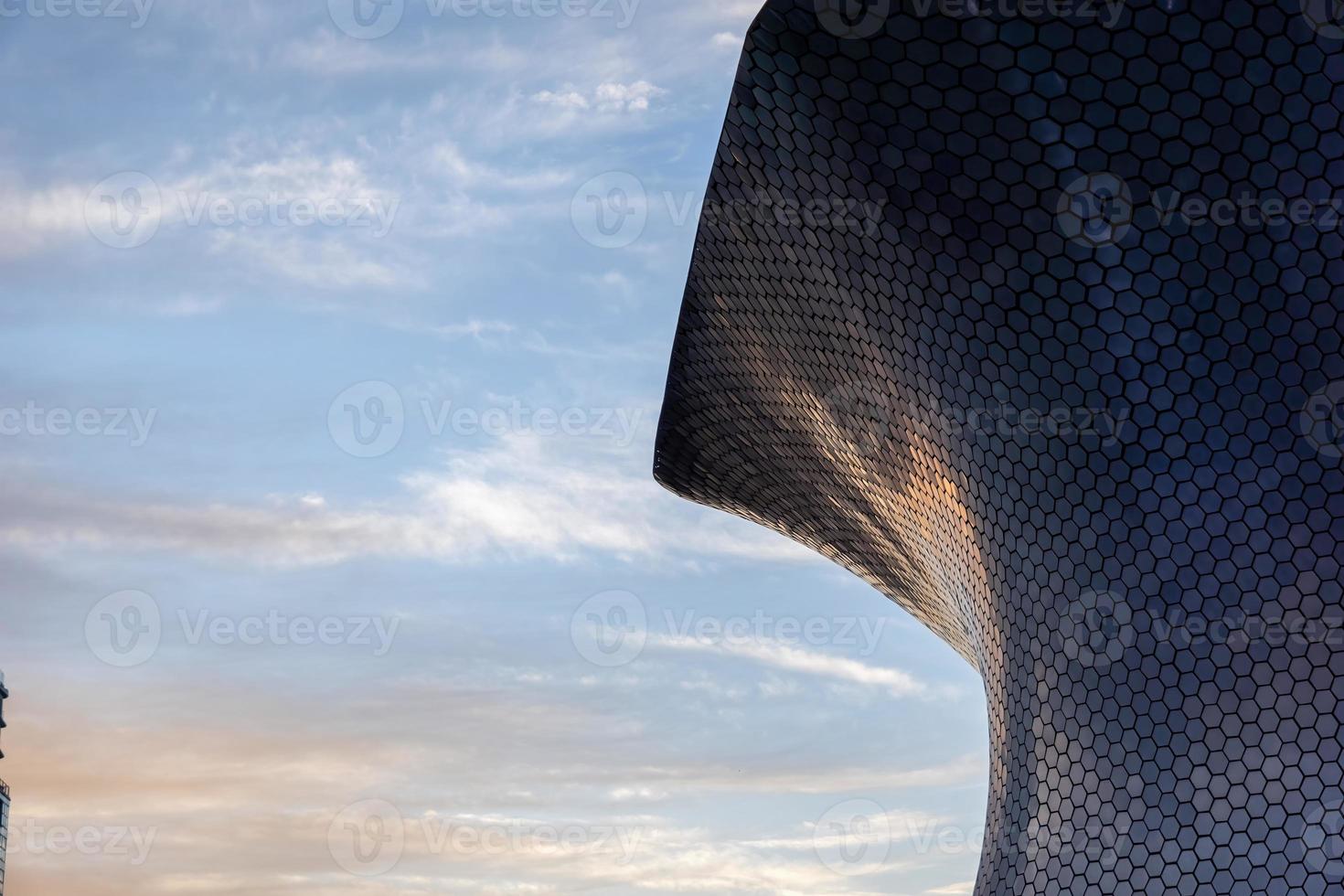 soumaya museum in CDMX, mexico. sunset reflection of the sunset on the building, aluminum panels or alucobon photo