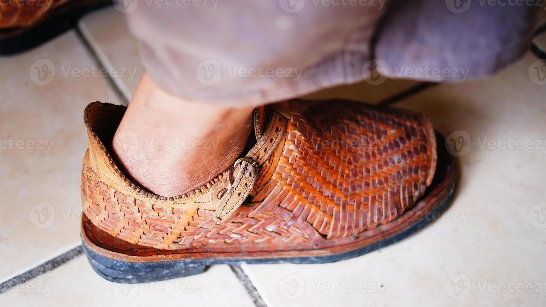 natural leather huarache, is a woven shoe made of cow or calfskin, it is used for freshness in the feet photo