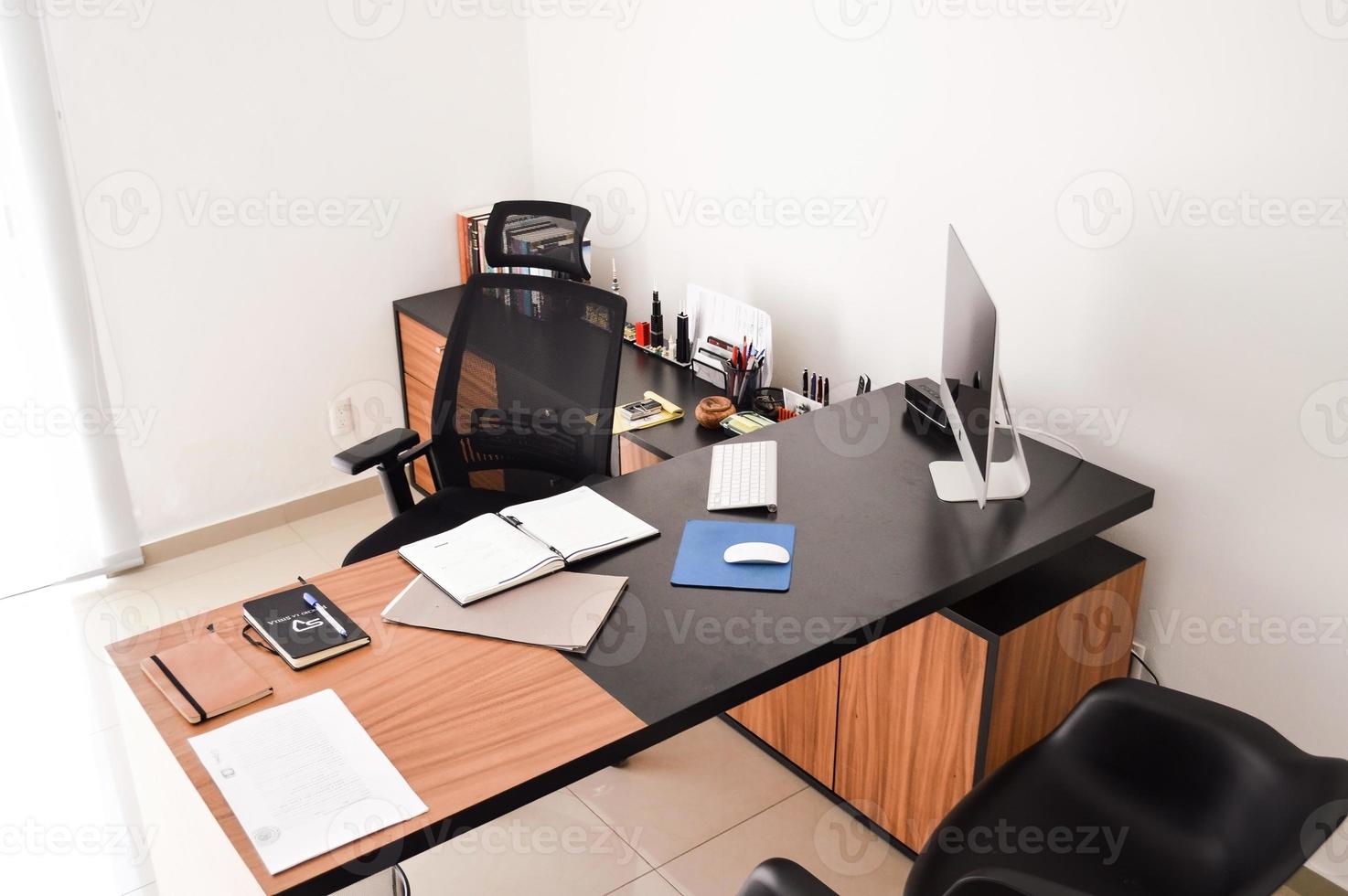 modern designer desk for office, business and creative spaces, Wooden desk in black color with storage drawers. photo