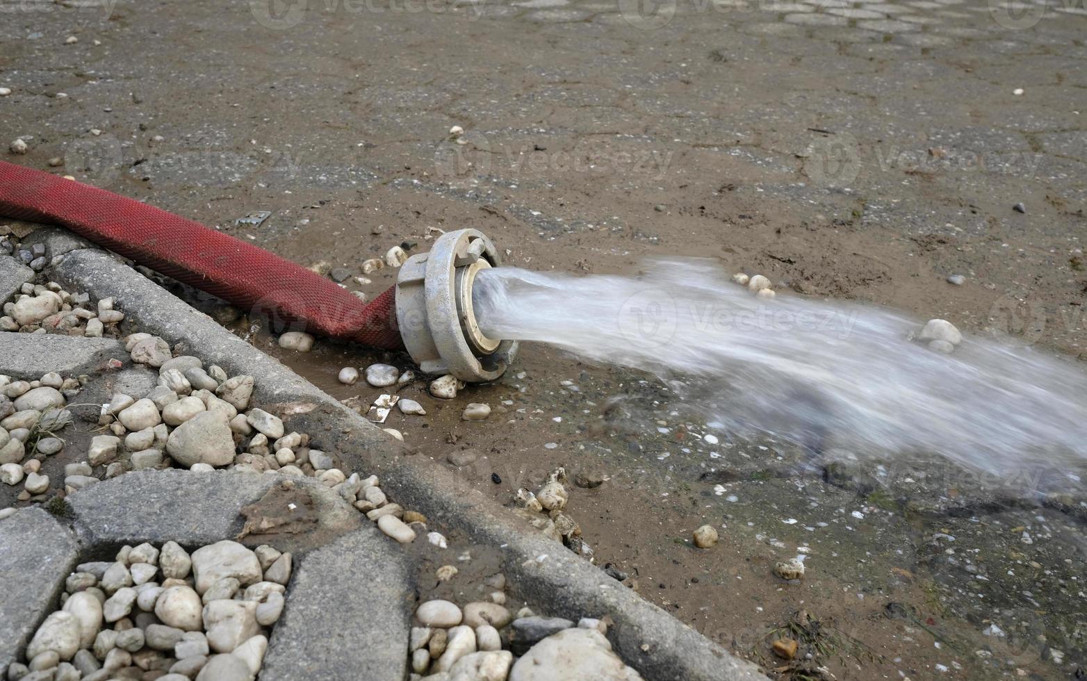 Extreme weather - water being pumped out of a flooded basement in Cologne, Germany, after heavy rain falls. photo