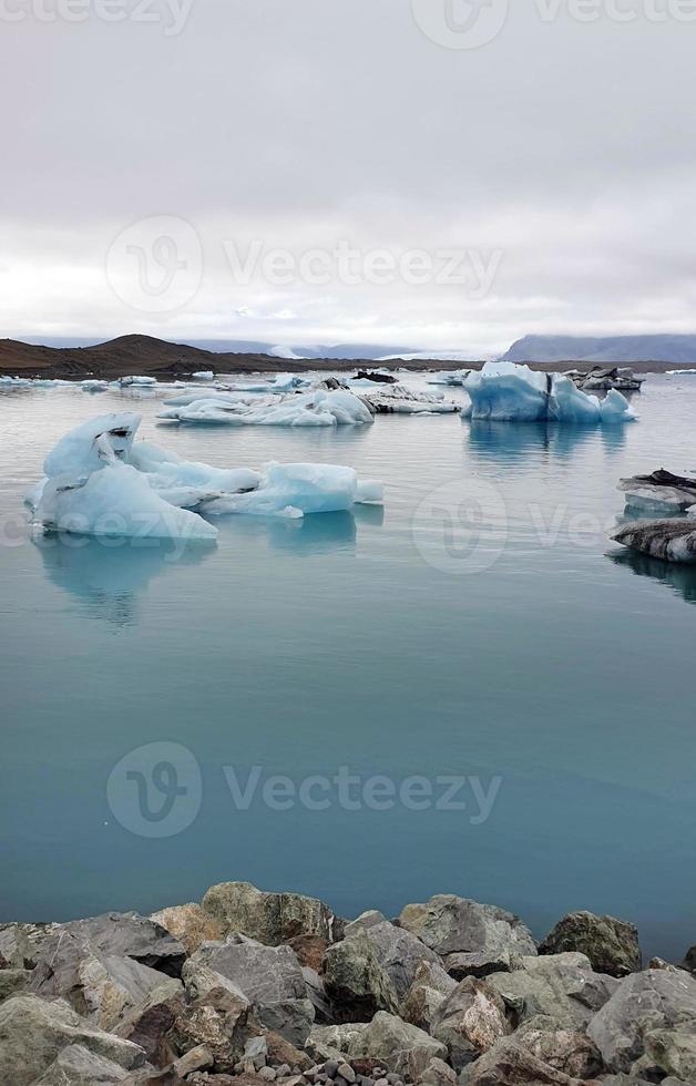 Jokulsarlon Glacier Lagoon in Iceland with icebergs and clear water photo