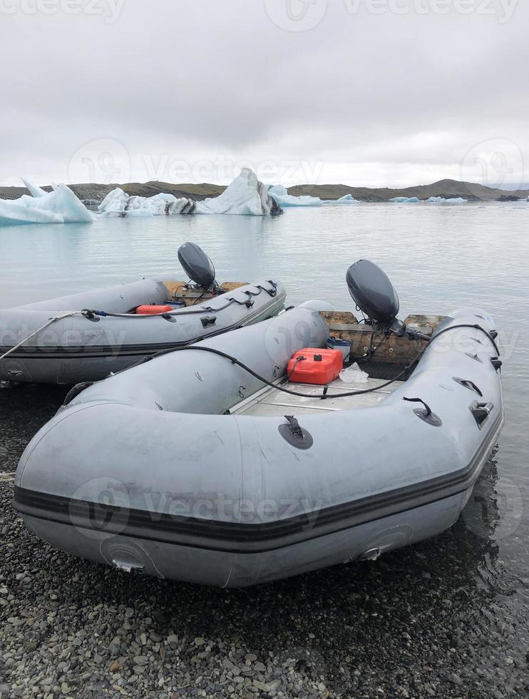 Rubber boats at a glacial lake in Iceland photo