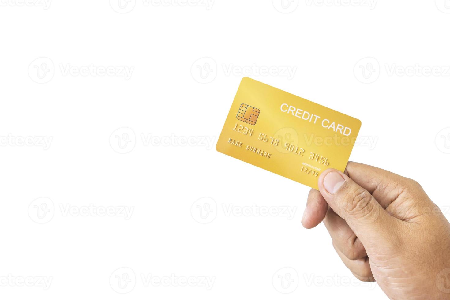 Close-up hand of Asian man holding yellow gold credit card in his hand. isolated on white background. Concept of finance, trading, communication, social, technology, business photo