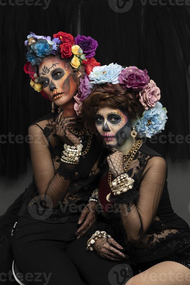 Female models with a sugar skull makeup. photo