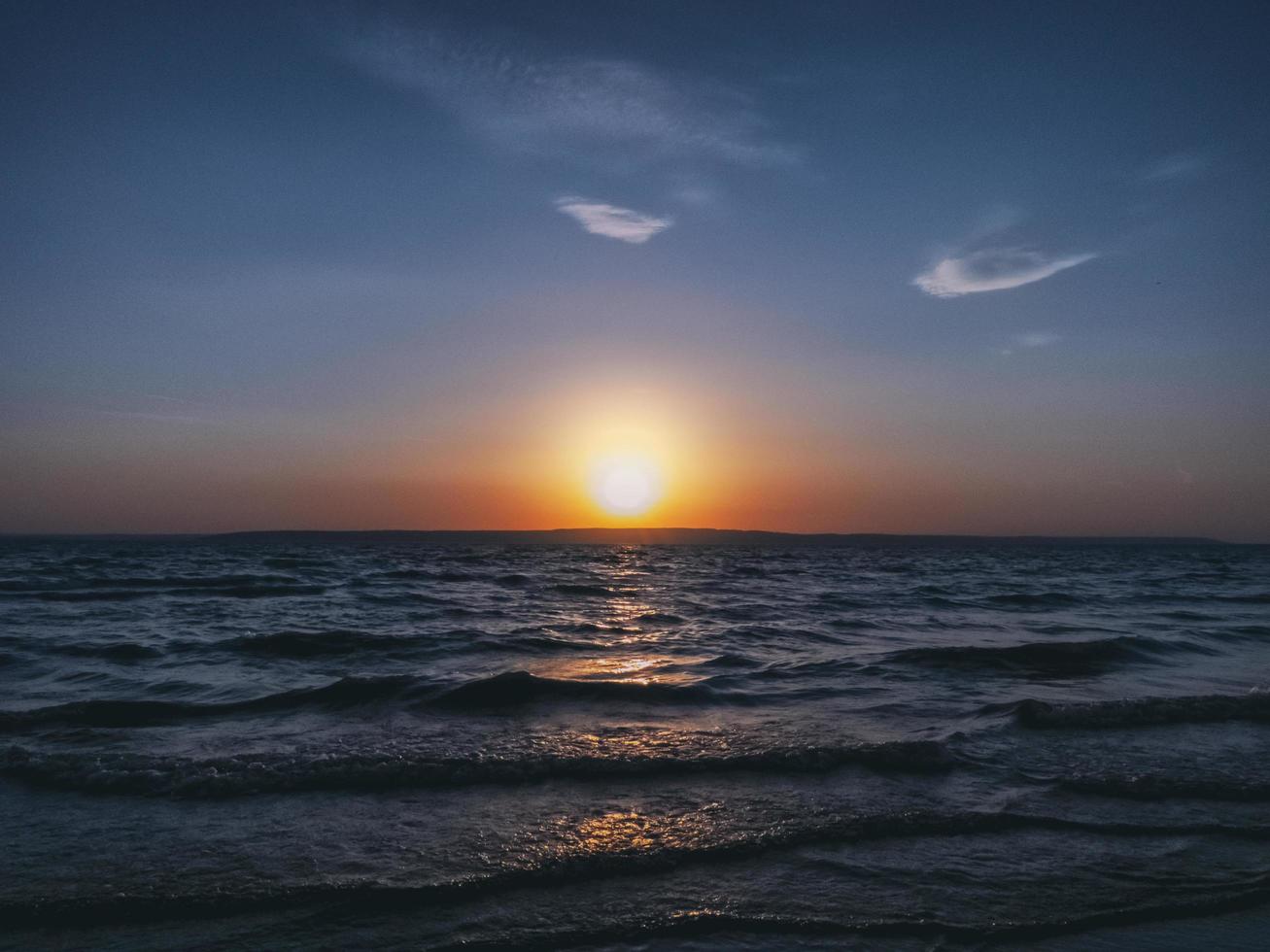 Beautiful seascape with the sun near the horizon. photo