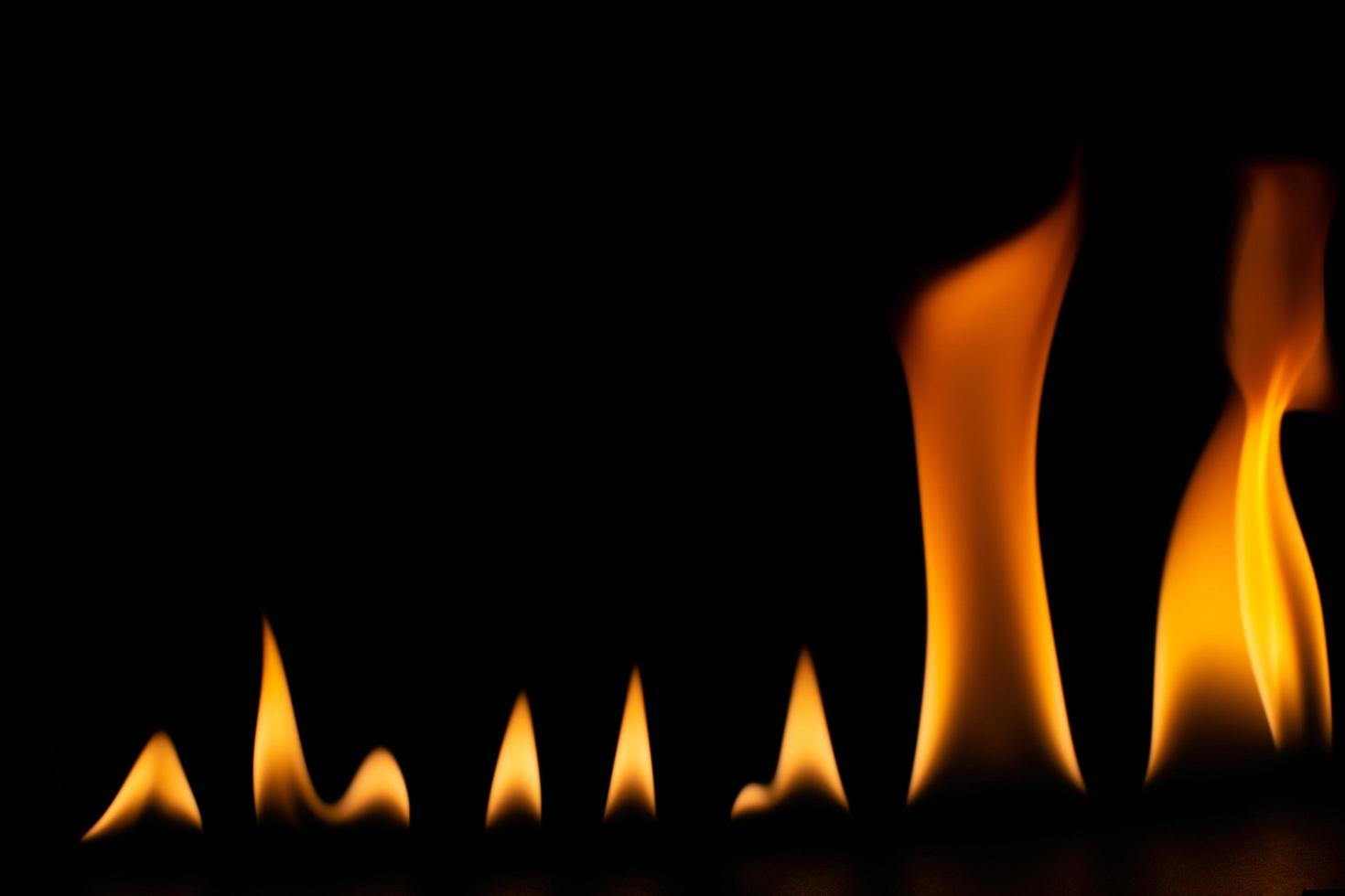burning power of the flame, Flames, and burning sparks close-up, fire patterns, the glow of fire in the dark photo