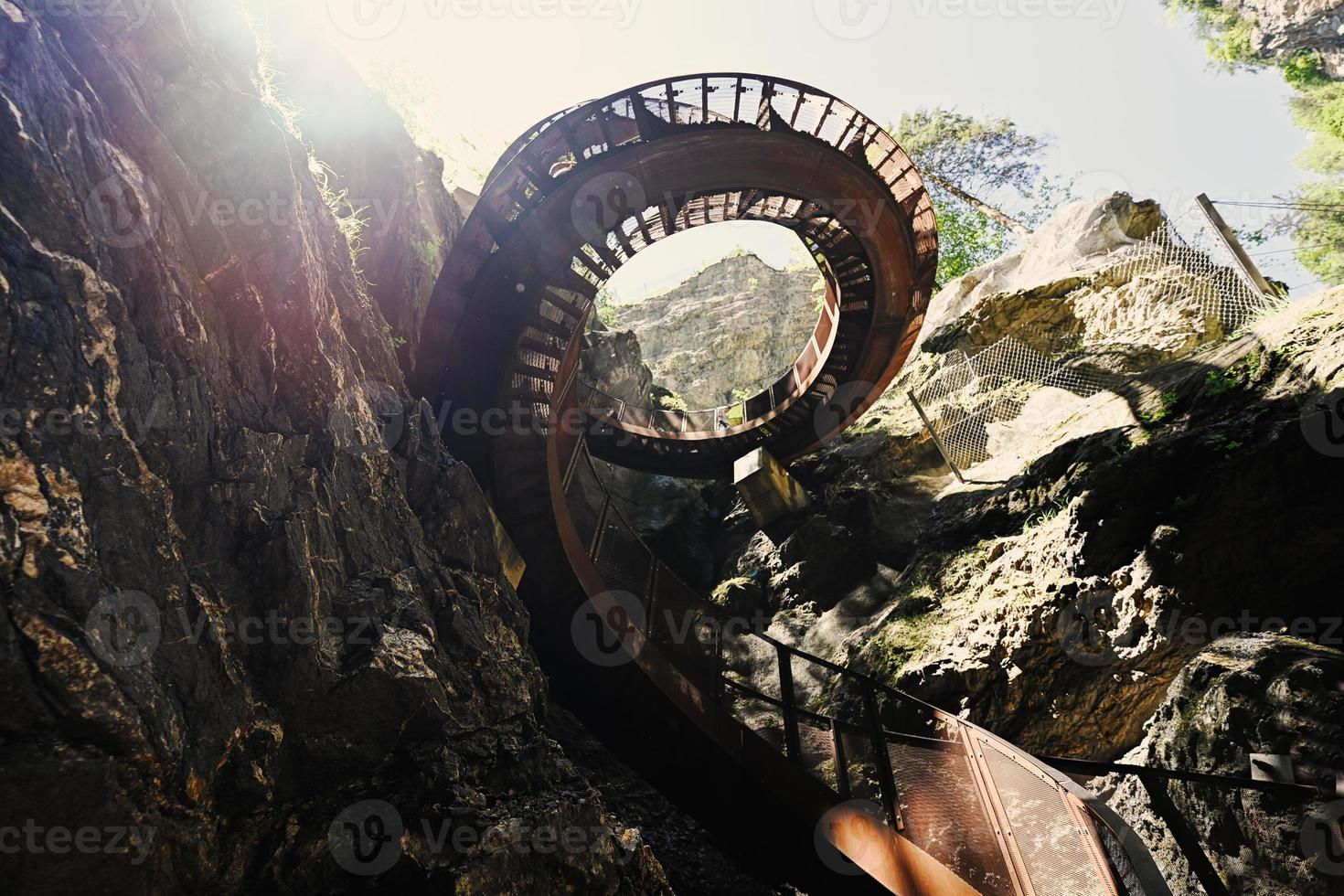 Metal spiral staircase in Liechtensteinklamm or Liechtenstein Gorge, particularly narrow gorge with walls, located in the Austrian Alps, near Salzburg, Austria. photo