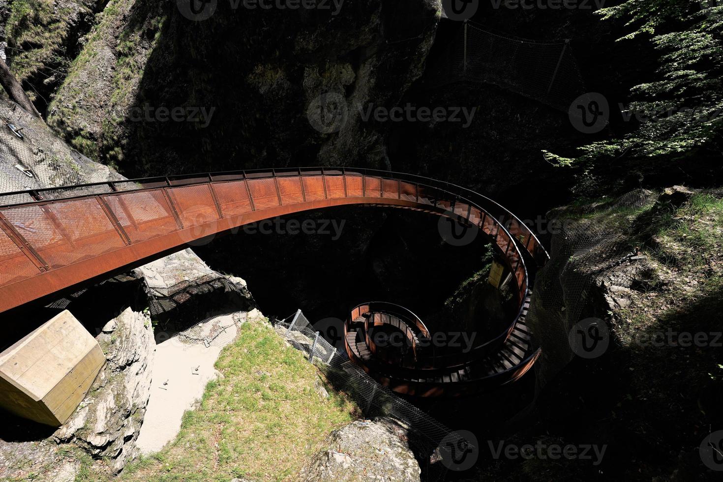 Metal spiral staircase in Liechtensteinklamm or Liechtenstein Gorge, particularly narrow gorge with walls, located in the Austrian Alps, near Salzburg, Austria. photo