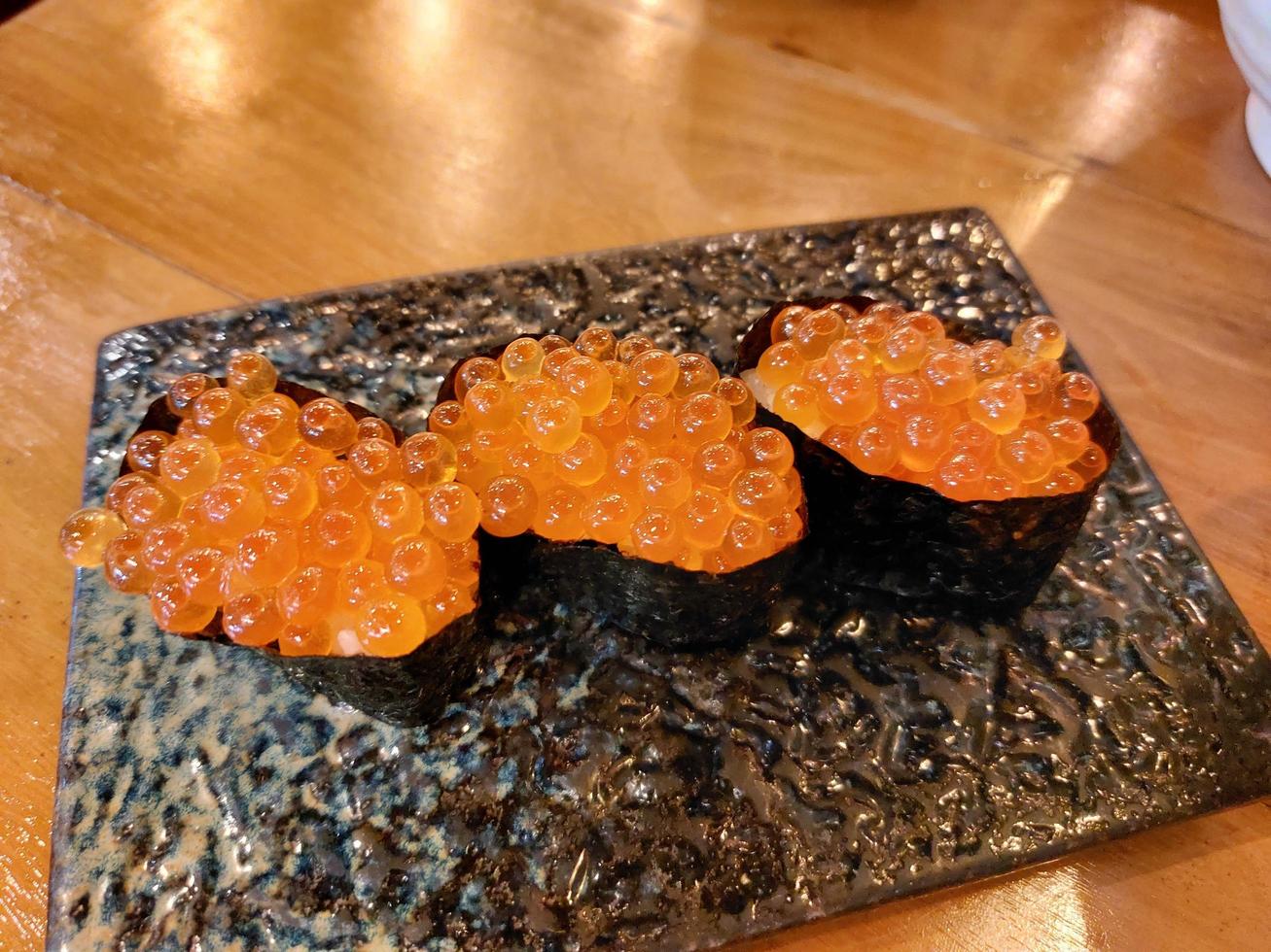 Japanese food called Ikura Onigiri, salmon roe roll wrapped in seaweed