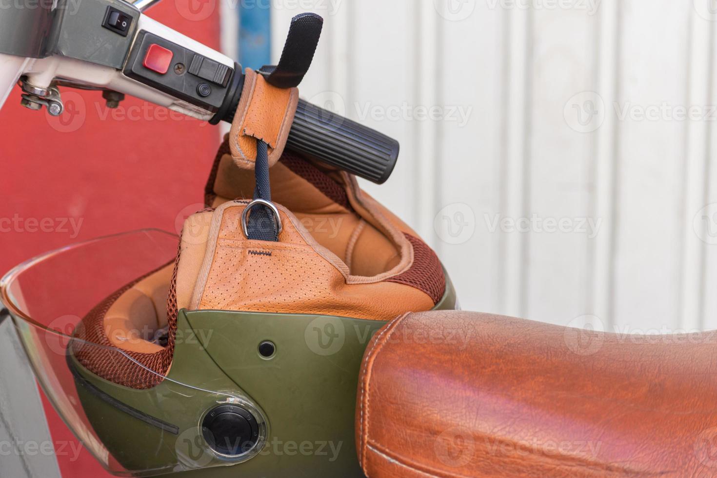 motorcycle helmet on classic motorcycle handlebars photo