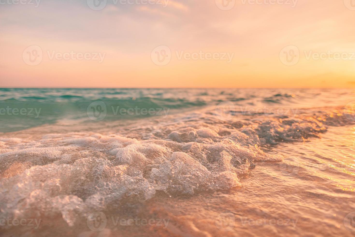 Relaxing waves splashing on tropical island shore under sunset light. Idyllic relaxing nature closeup, blue water coast, outdoor holiday. Macro natural, summer calming travel inspire seascape. photo