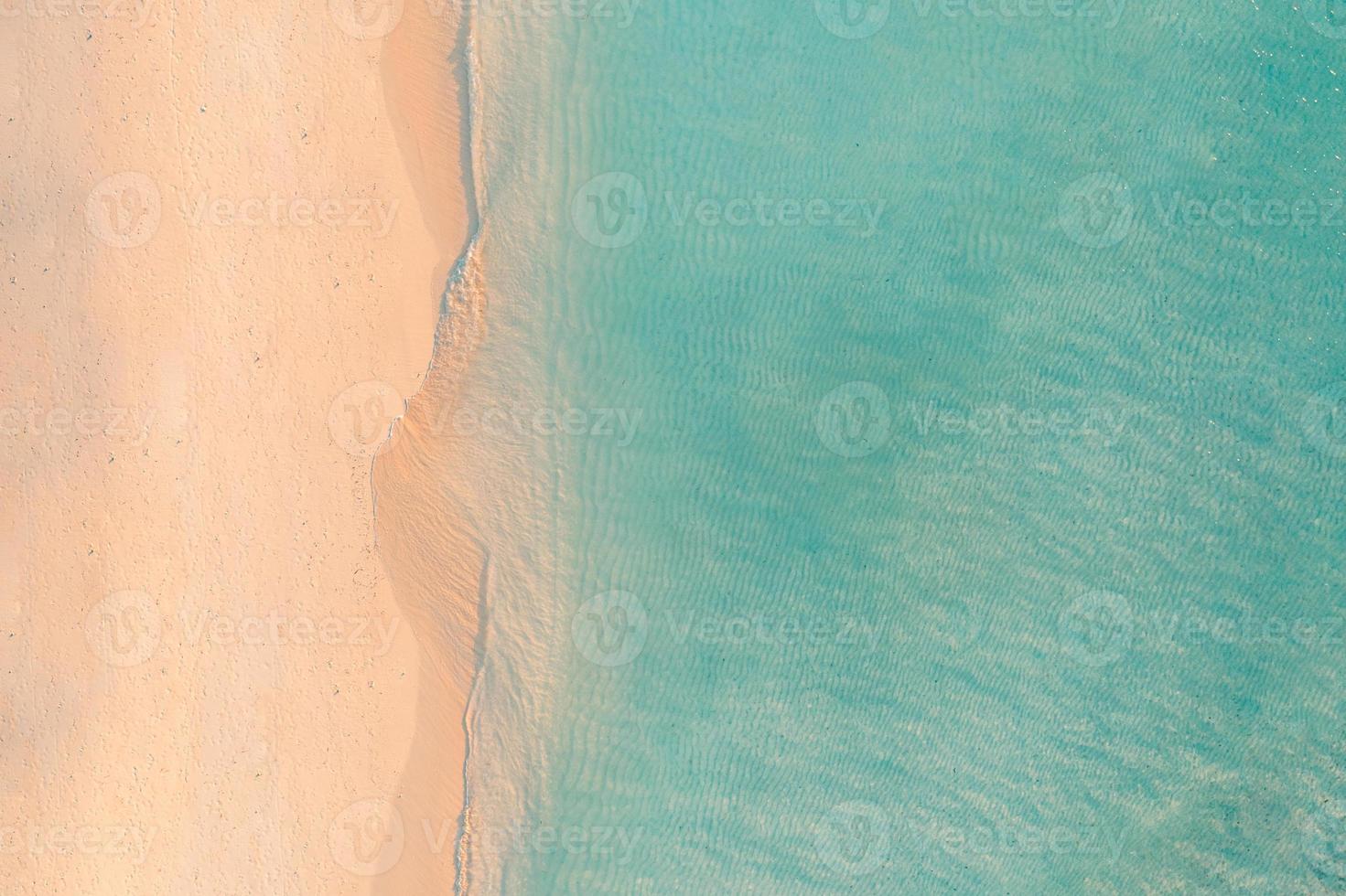 Beautiful aerial beach landscape, summer vacation holiday template banner. Waves surf with amazing blue ocean lagoon, sea shore, coastline. Amazing aerial drone top view. Relaxing bright beach seaside photo