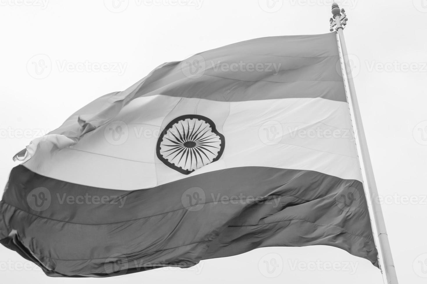India flag flying at Connaught Place with pride in blue sky, India flag fluttering, Indian Flag on Independence Day and Republic Day of India, waving Indian flag, Flying India flags - Black and White photo