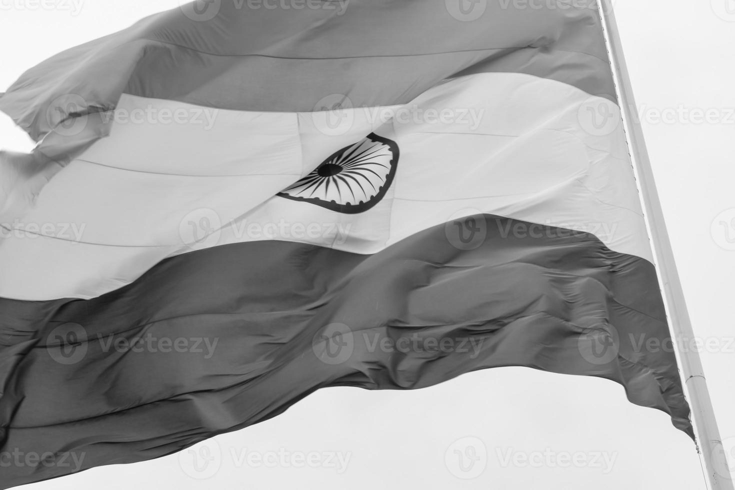 India flag flying at Connaught Place with pride in blue sky, India flag fluttering, Indian Flag on Independence Day and Republic Day of India, waving Indian flag, Flying India flags - Black and White photo