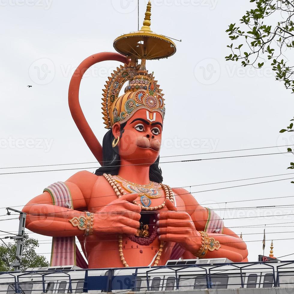 Big statue of Lord Hanuman near the delhi metro bridge situated near Karol Bagh, Delhi, India, Lord Hanuman big statue touching sky photo