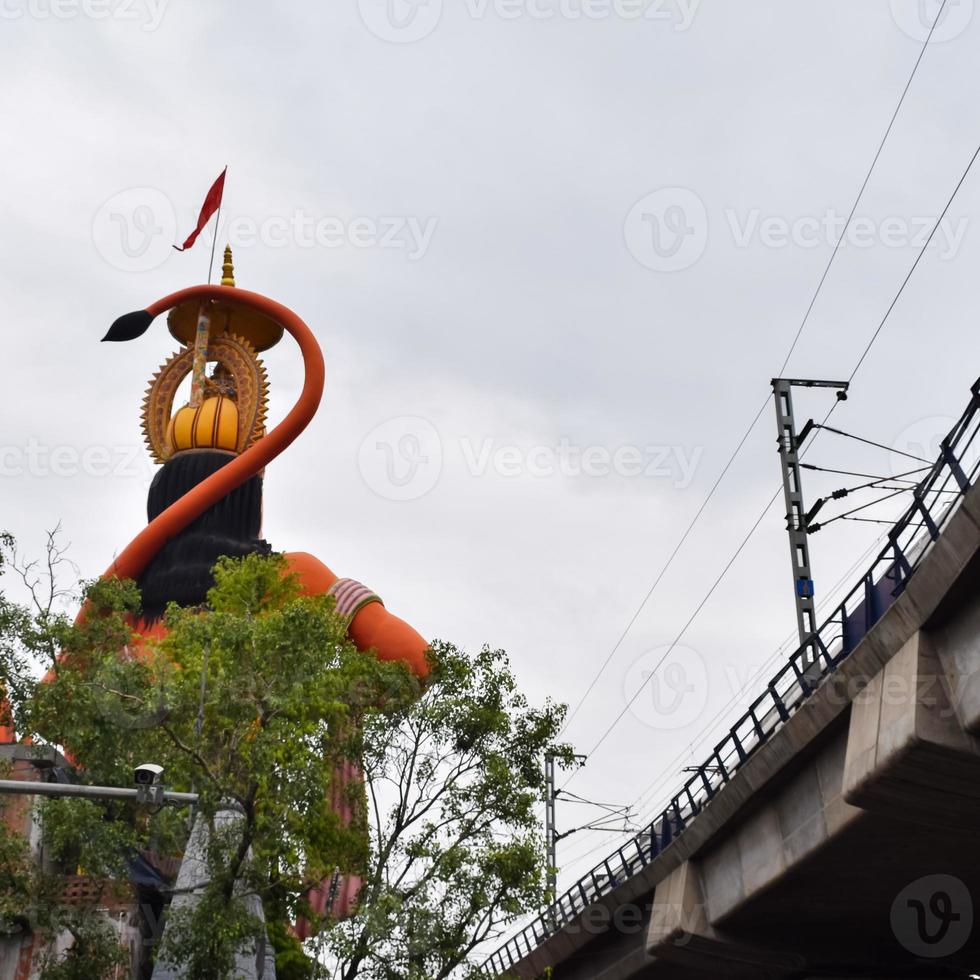 Big statue of Lord Hanuman near the delhi metro bridge situated near Karol Bagh, Delhi, India, Lord Hanuman big statue touching sky photo