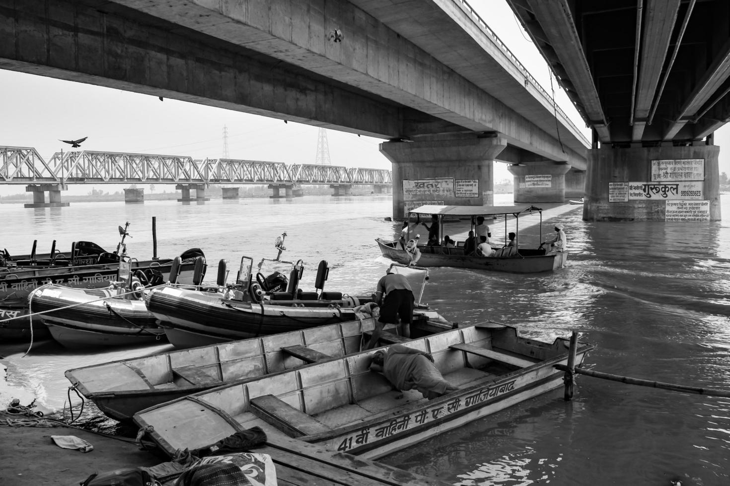 Garh Mukteshwar, UP, India, June 11 2022 -People are taking holy dip on the occasion of Nirjala Ekadashi, A view of Garh Ganga Brij ghat which is very famous religious place for Hindus-Black and White photo