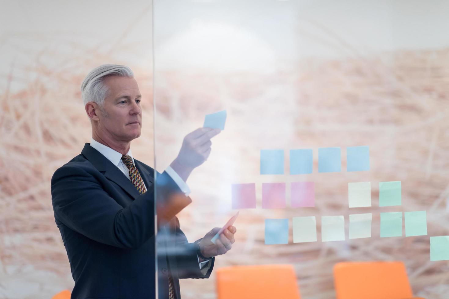 senior business man making plans with sticker photo