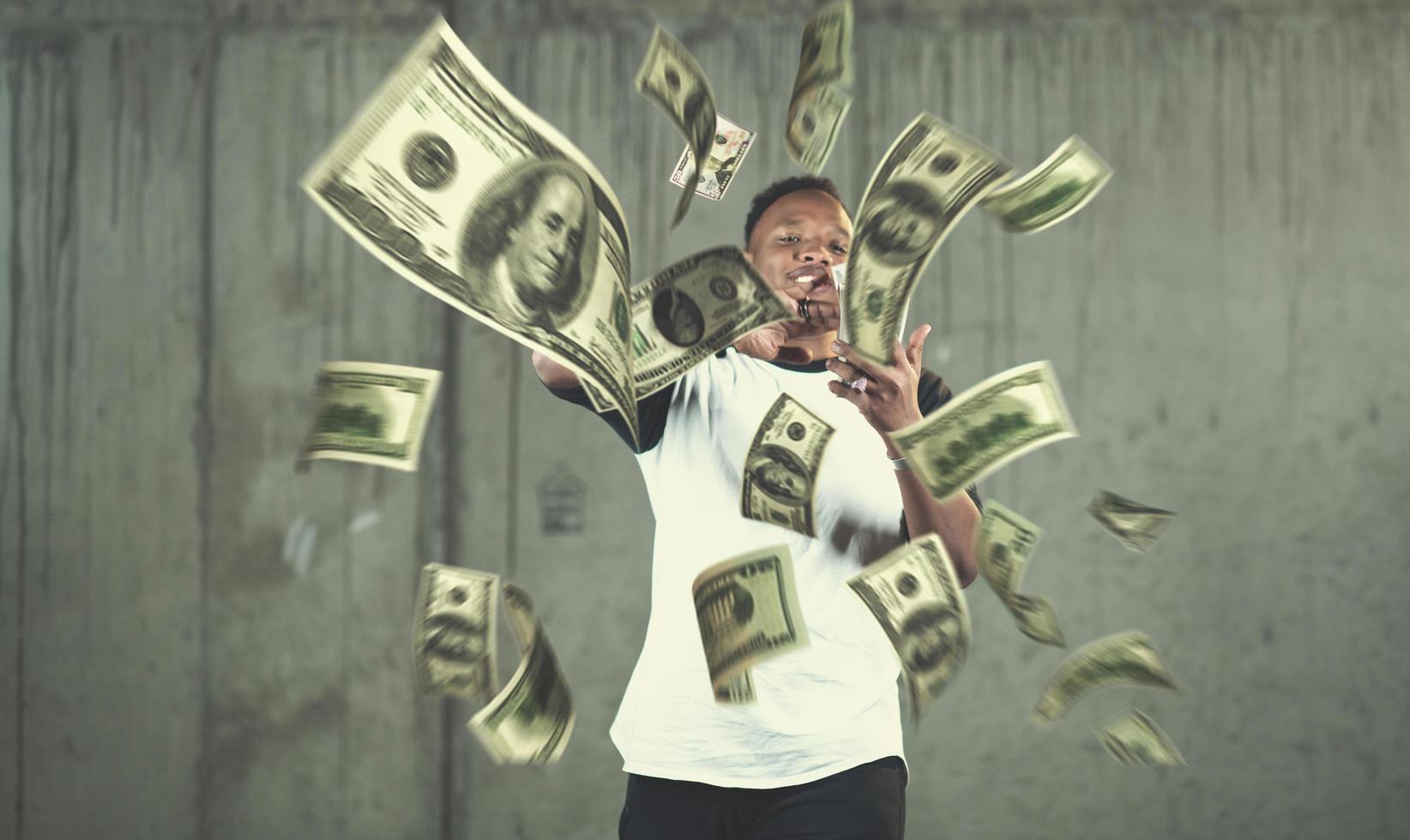 black businessman making the rain of money photo