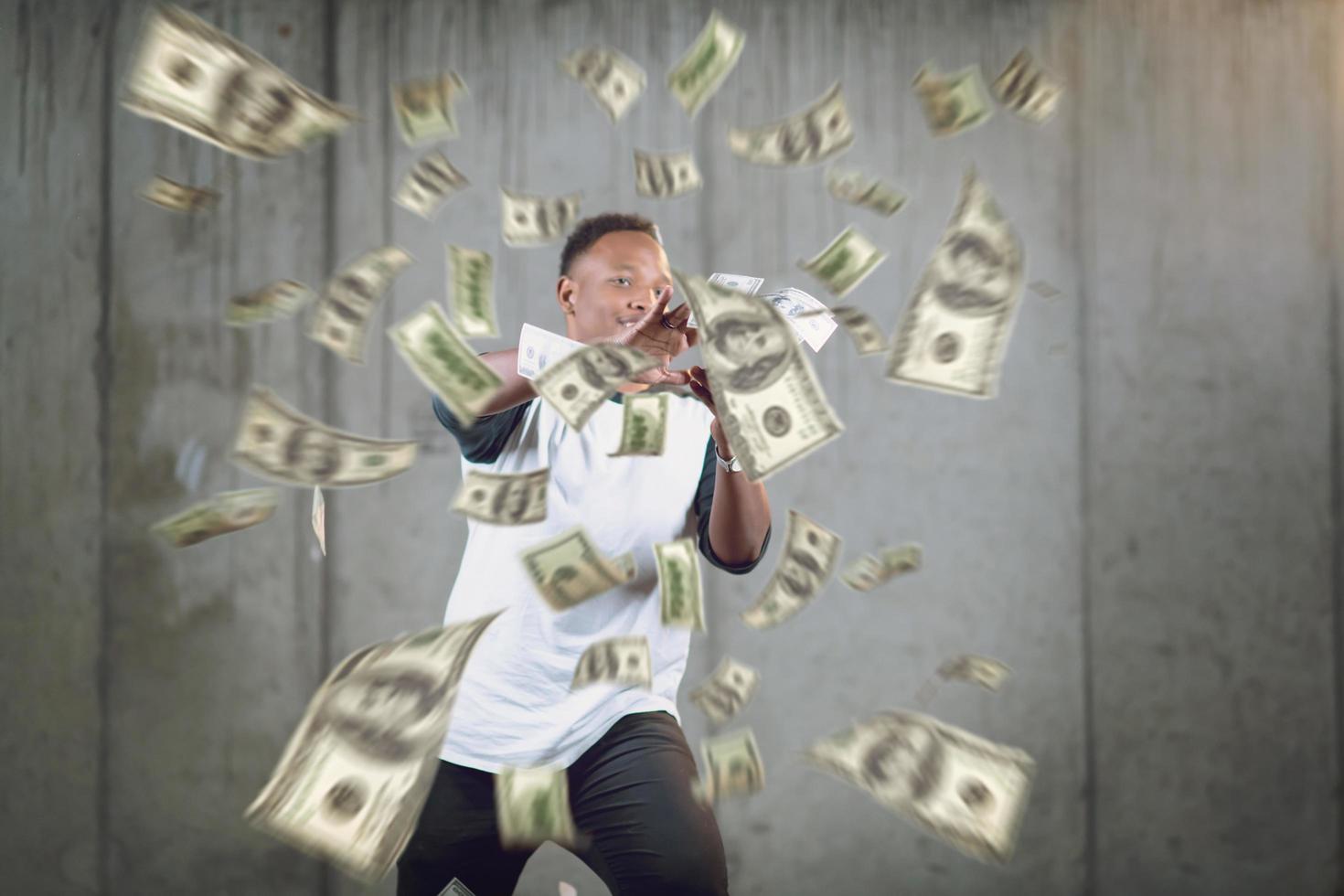 black businessman making the rain of money photo