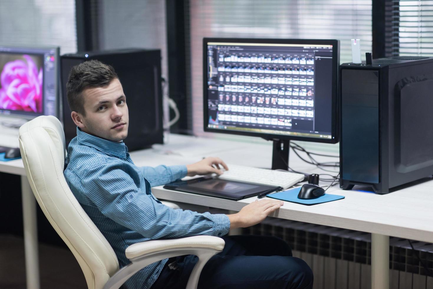 photo editor at his desk