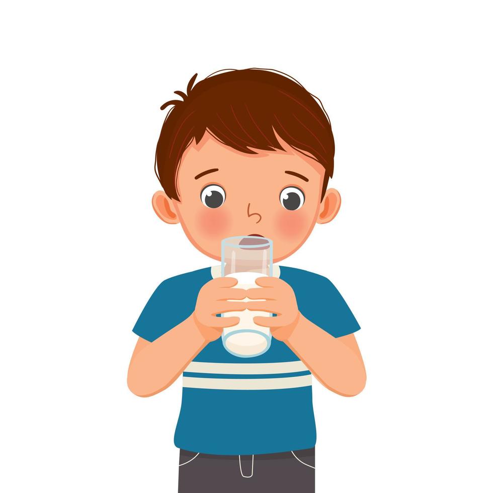 lindo niño bebiendo un vaso de leche vector