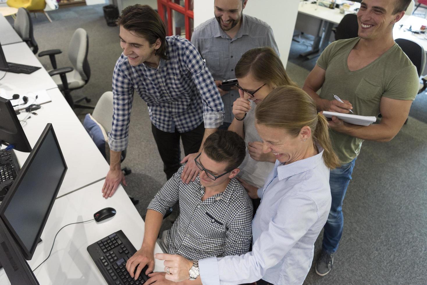 startup business people group working as team to find solution photo