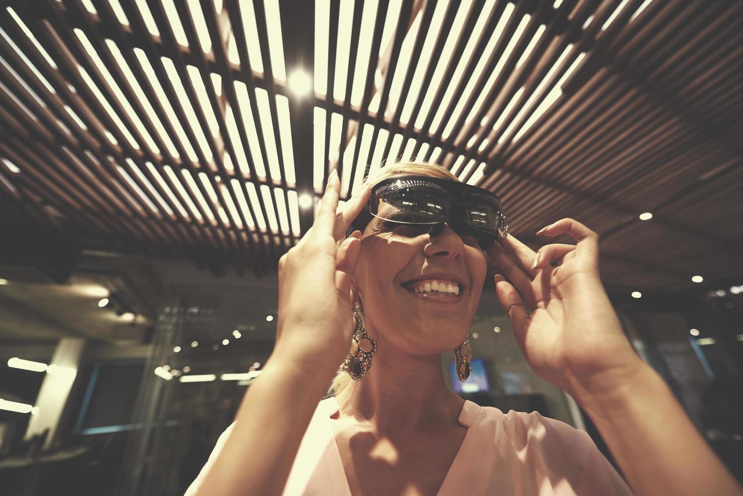 woman using virtual reality gadget computer glasses photo