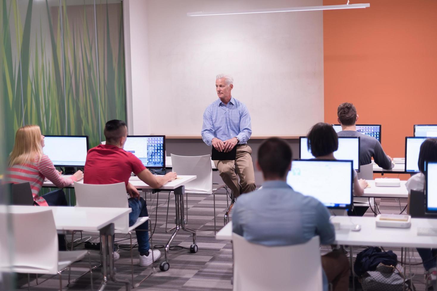 teacher and students in computer lab classroom photo