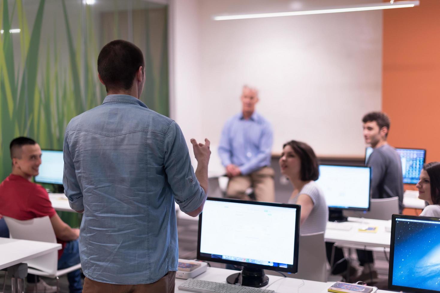 student answering a question in classroom photo