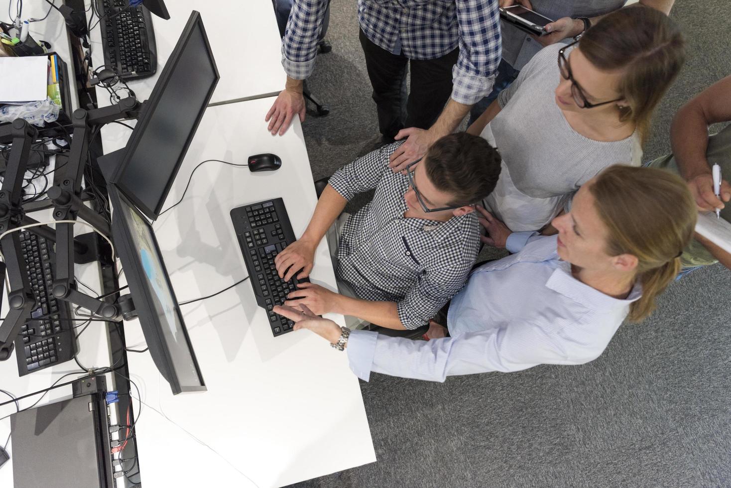 startup business people group working as team to find solution photo