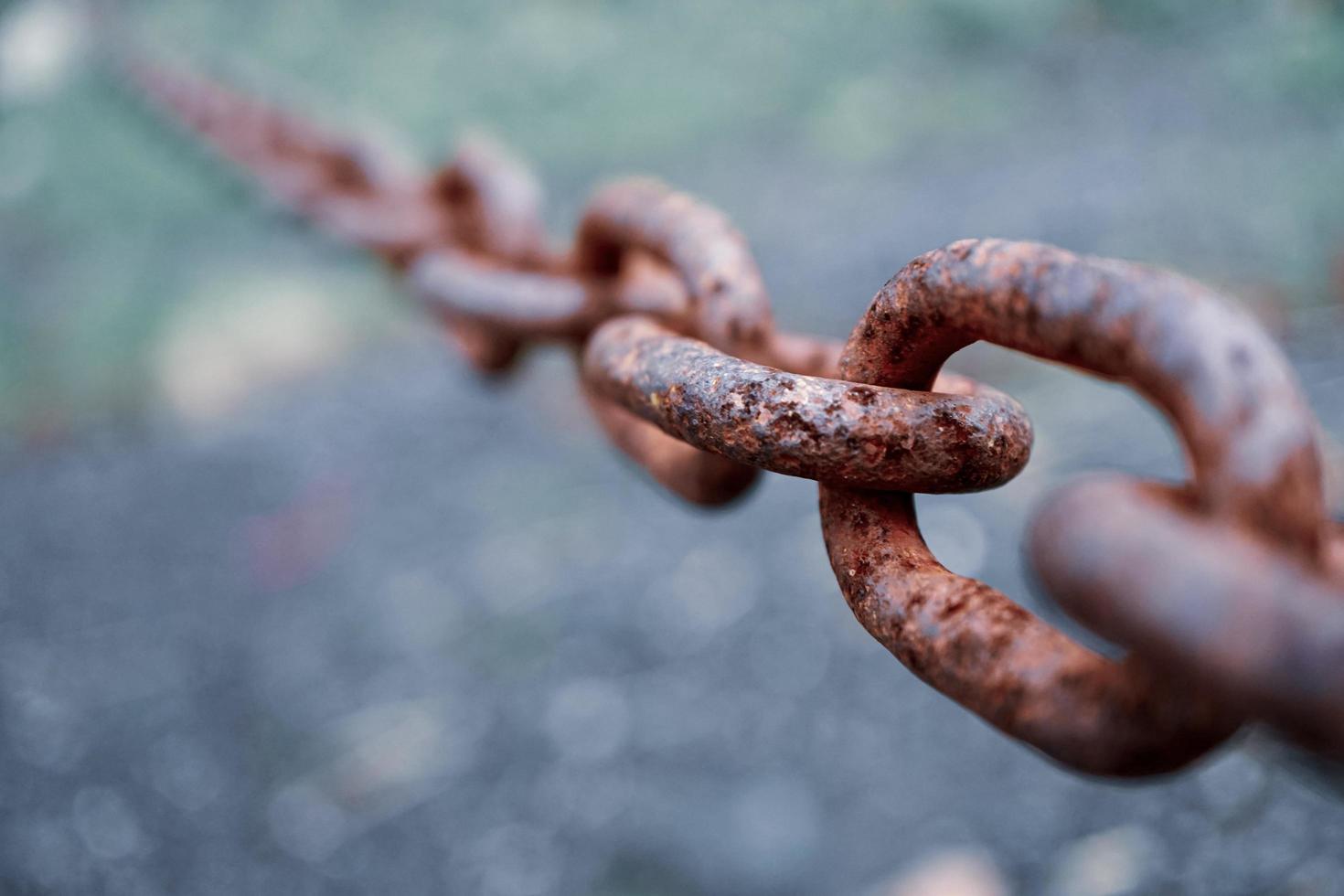 fence with an old rusty chain photo