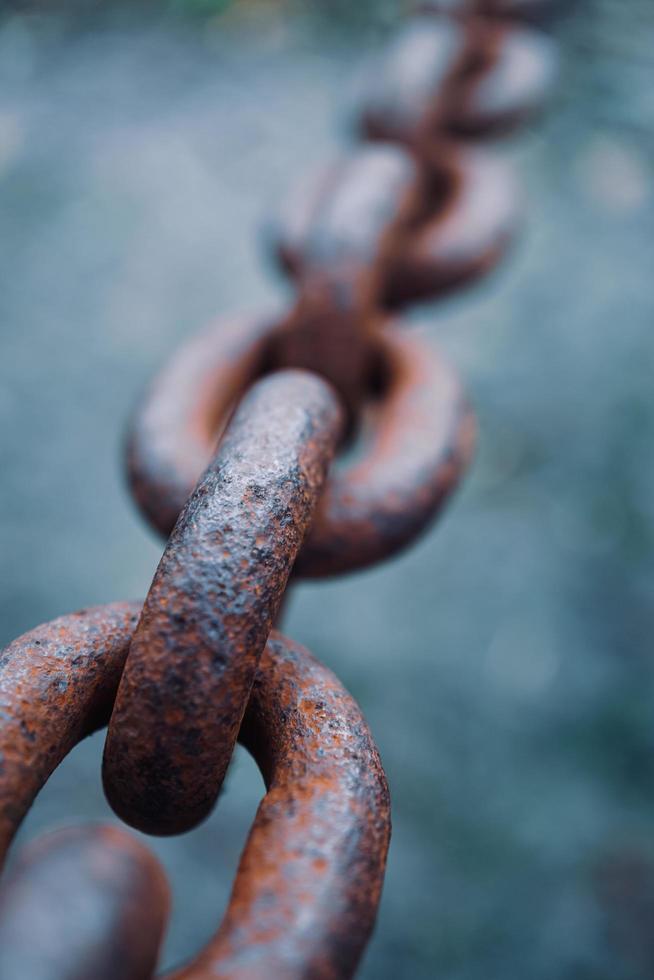 fence with an old rusty chain photo