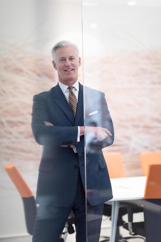 portrait of handsome senior business man at modern office photo
