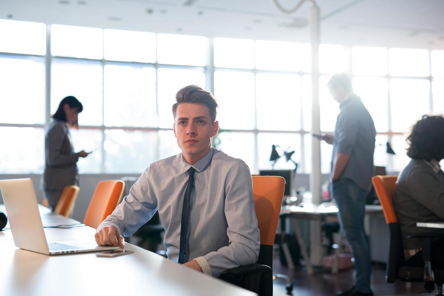 businessman working using a laptop in startup office photo