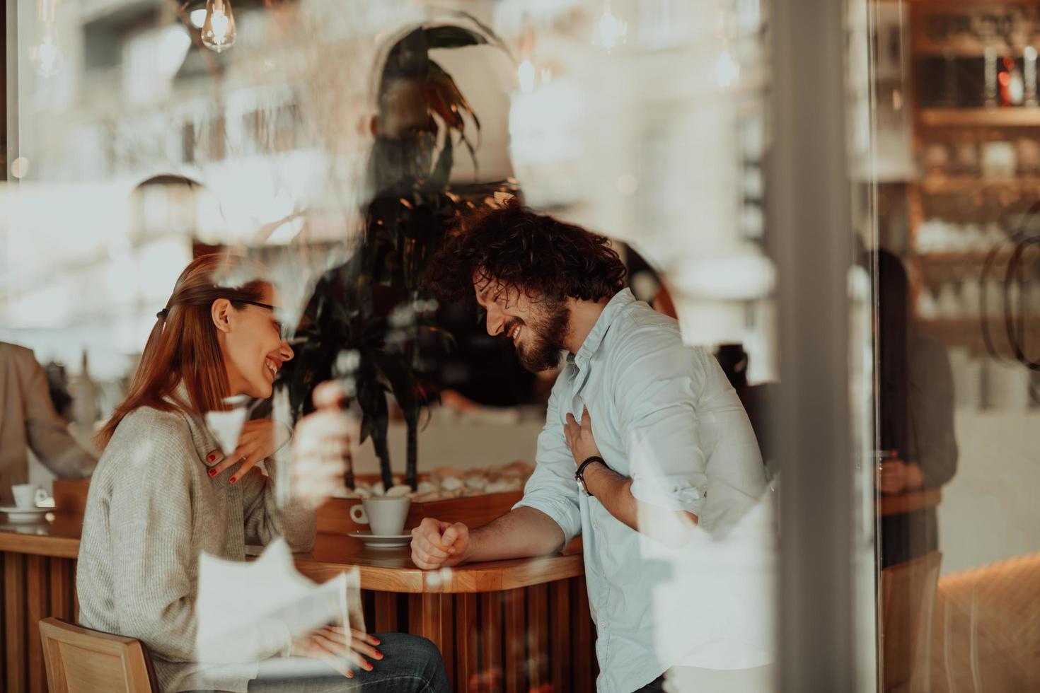 business couple sits in a cafe after a weekday photo