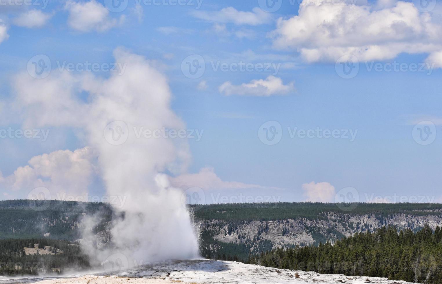 Old Faithful Geyser In Yellowstone National Park photo