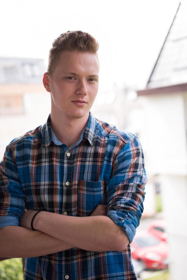 man standing at balcony photo