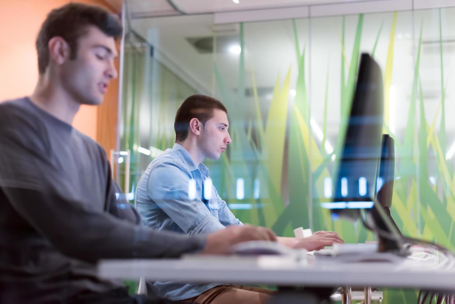 technology students group working  in computer lab school  classroom photo