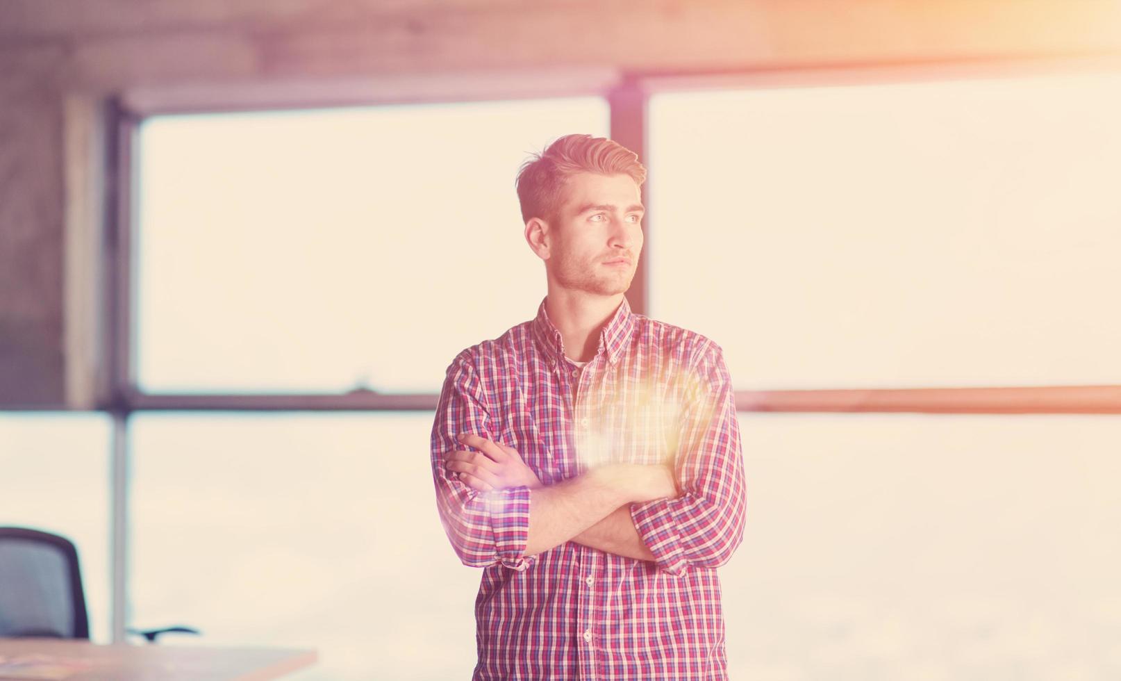 portrait of young casual businessman on construction site photo